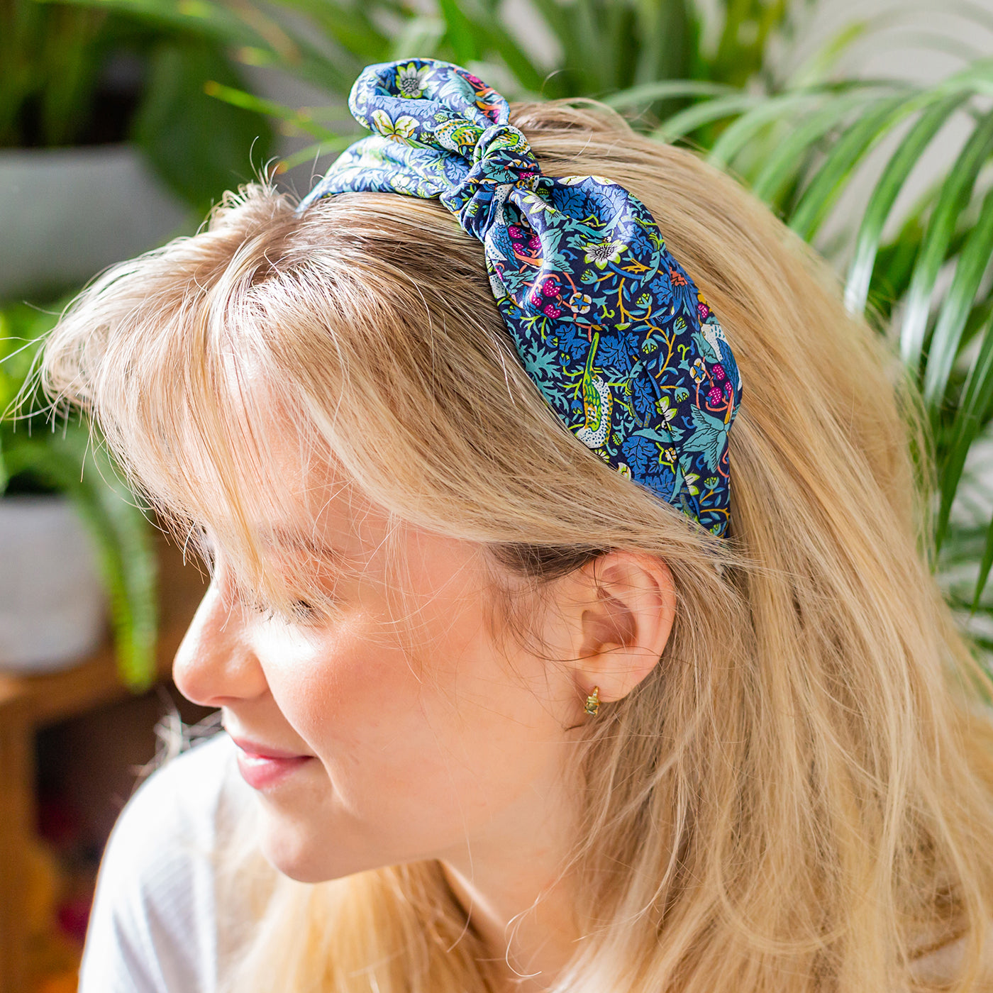 About Us | Model wearing side bow headband | Holme & Moss