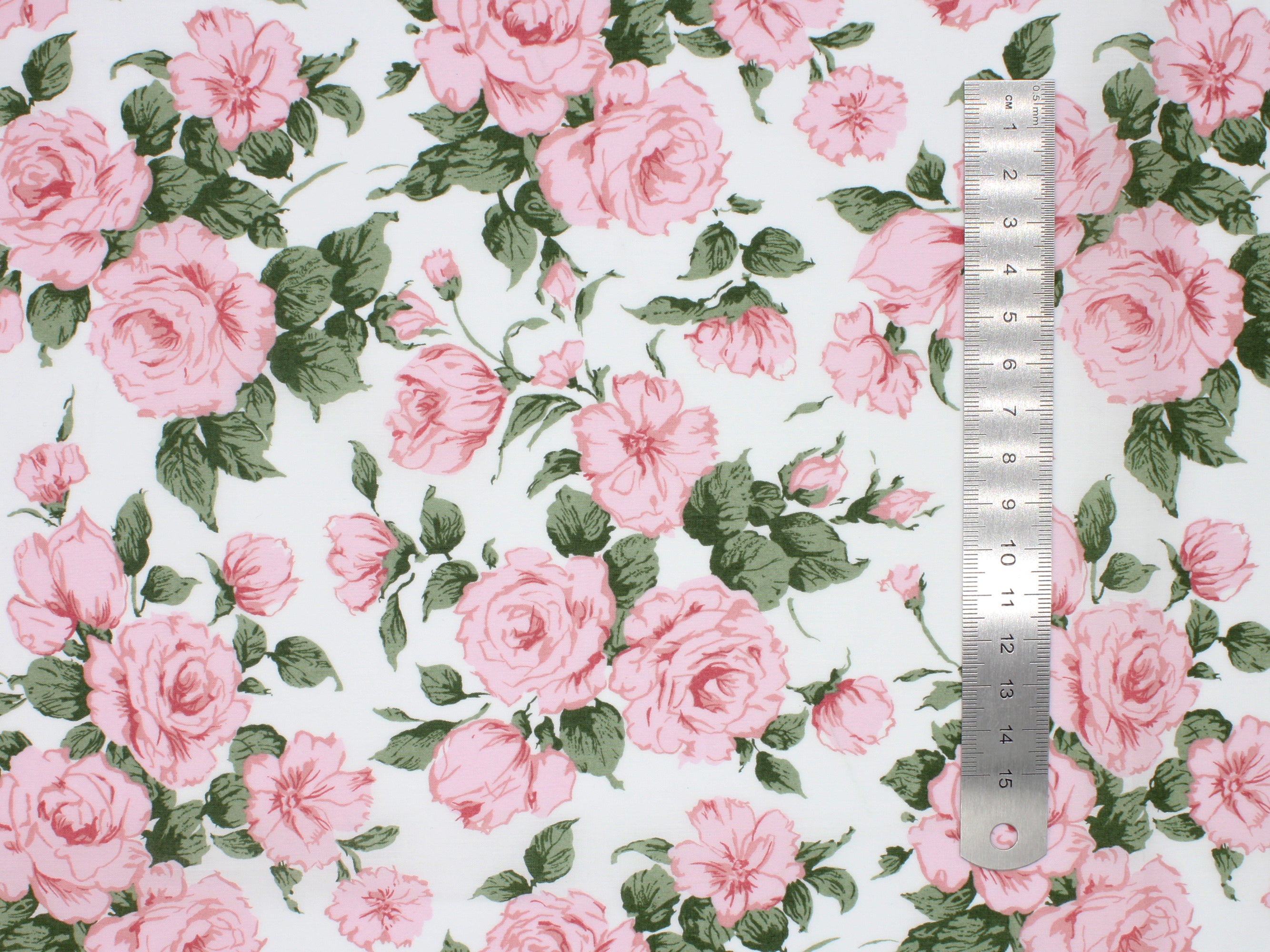 Clarabell A Liberty Fabrics Tana Lawn Cotton Print | Holme & Moss Fabric Shop | Floral fabric with pink roses and green leaves on an off-white background