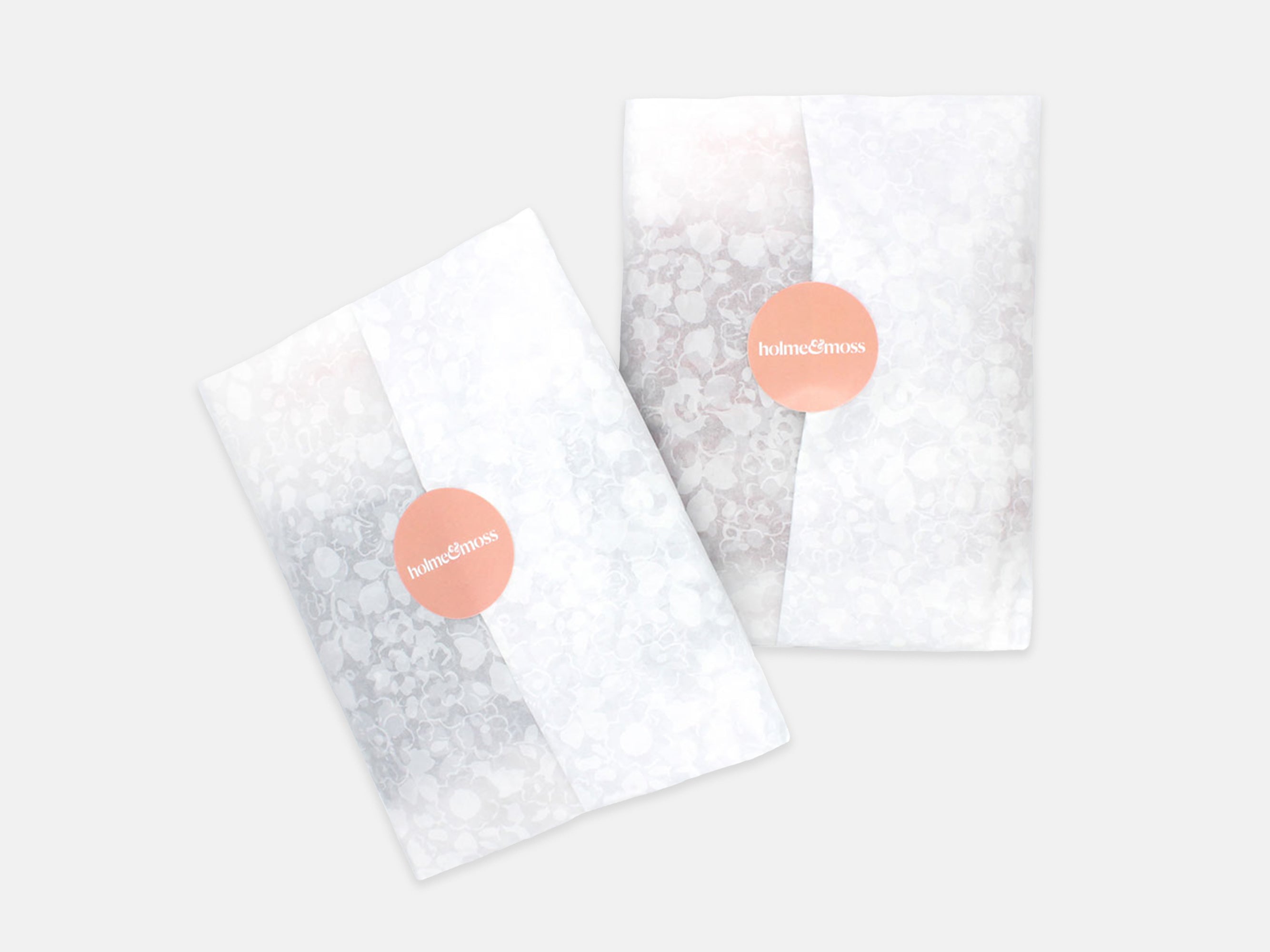 Product wrapped in tissue paper and sealed with a Holme & Moss sticker.