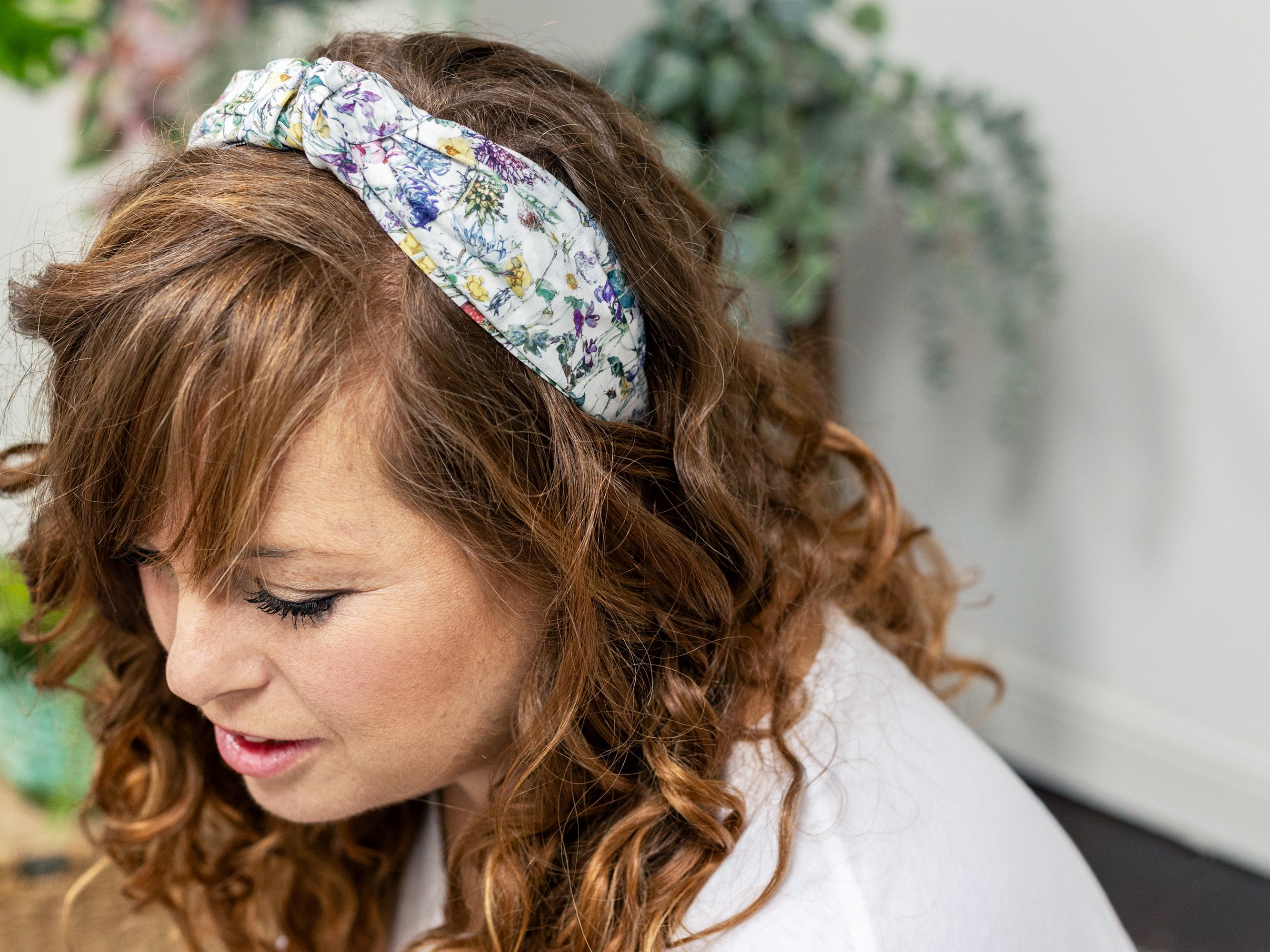 A Model Wearing A Classic Knot Headband, Liberty London Wild Flowers Print | Holme & Moss