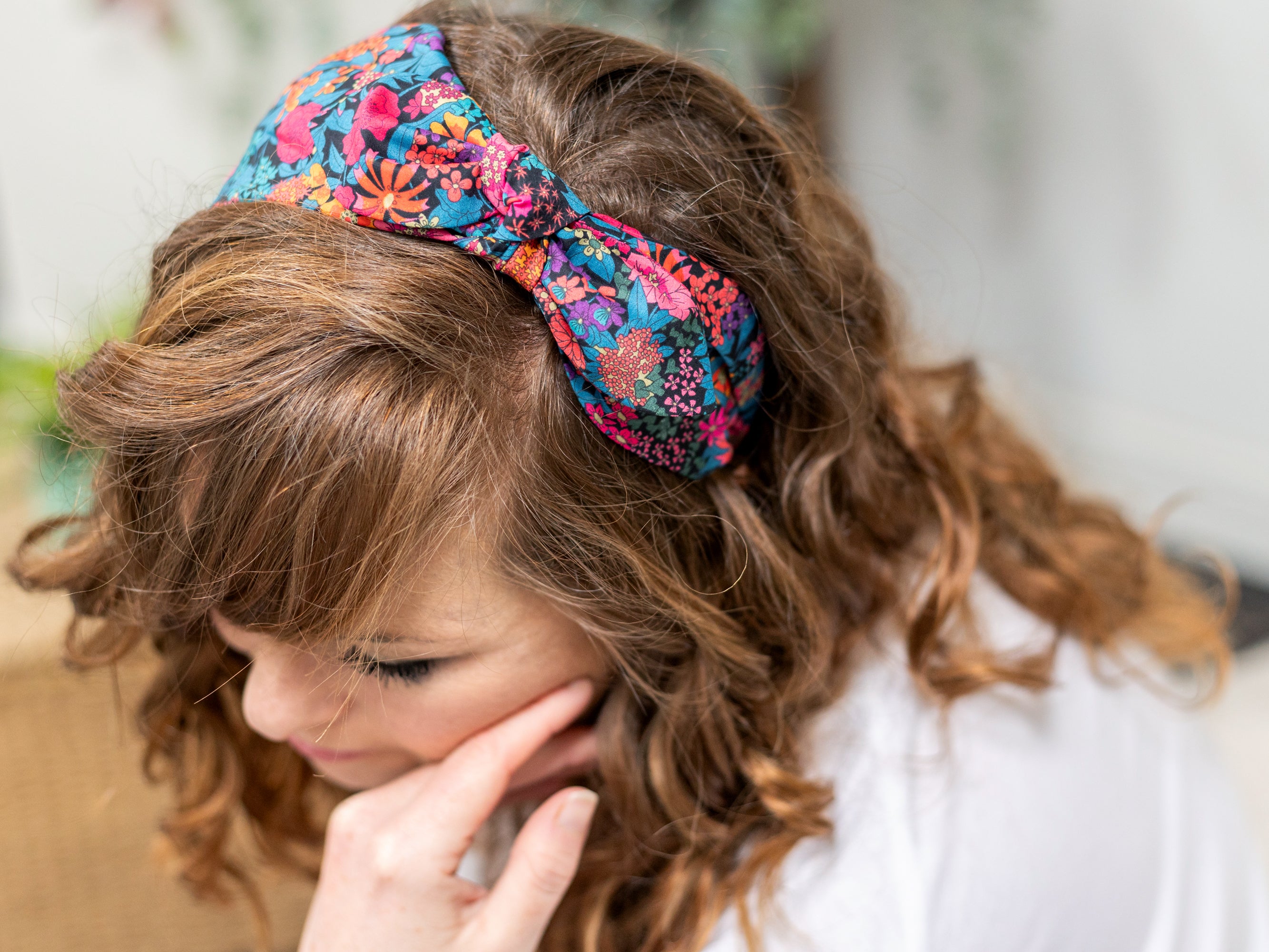 A Model Wearing a Side Bow Headband, Liberty London Ciara C Print | Holme & Moss