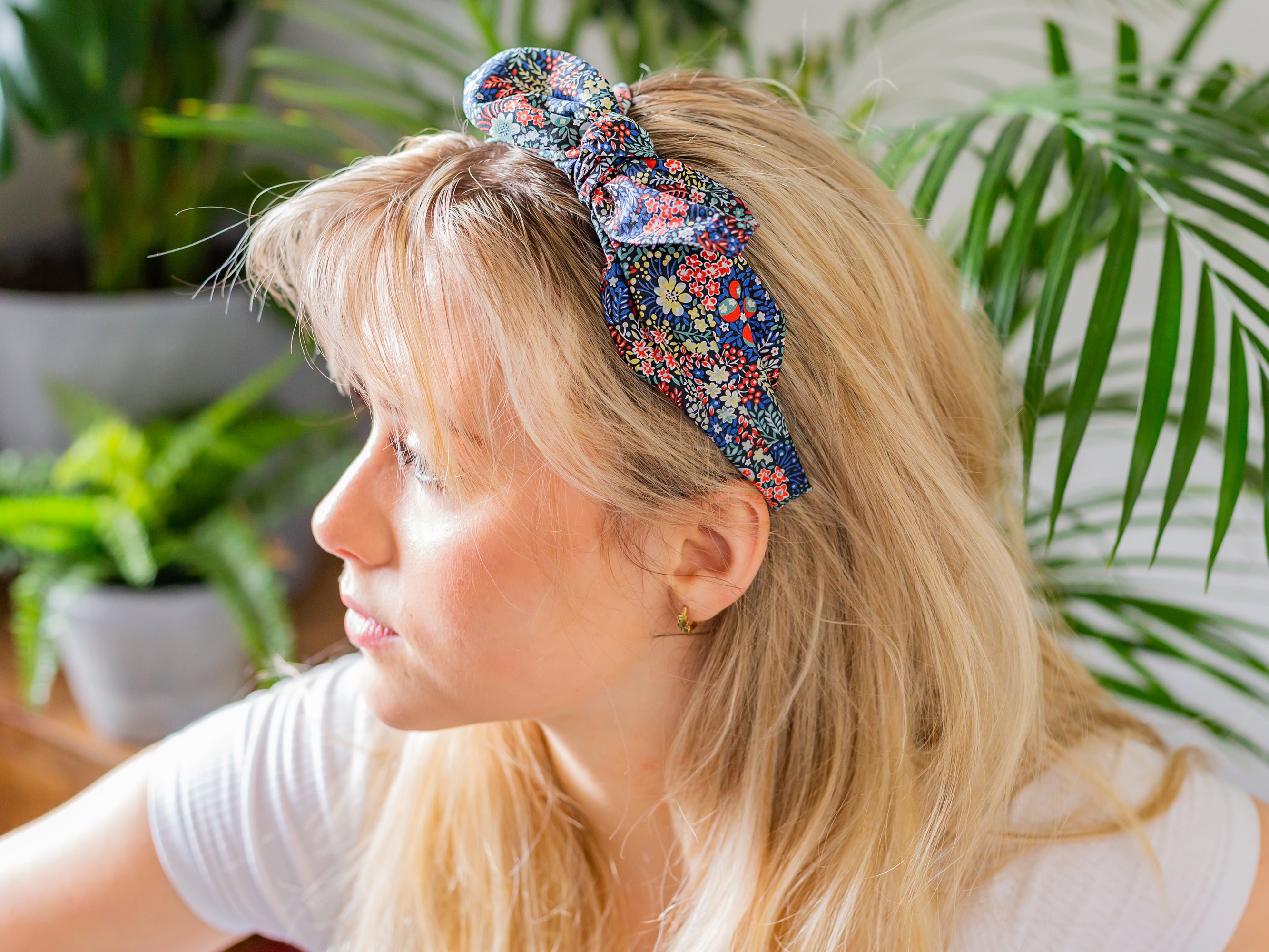 A woman wearing a Liberty London print side bow headband | Holme & Moss