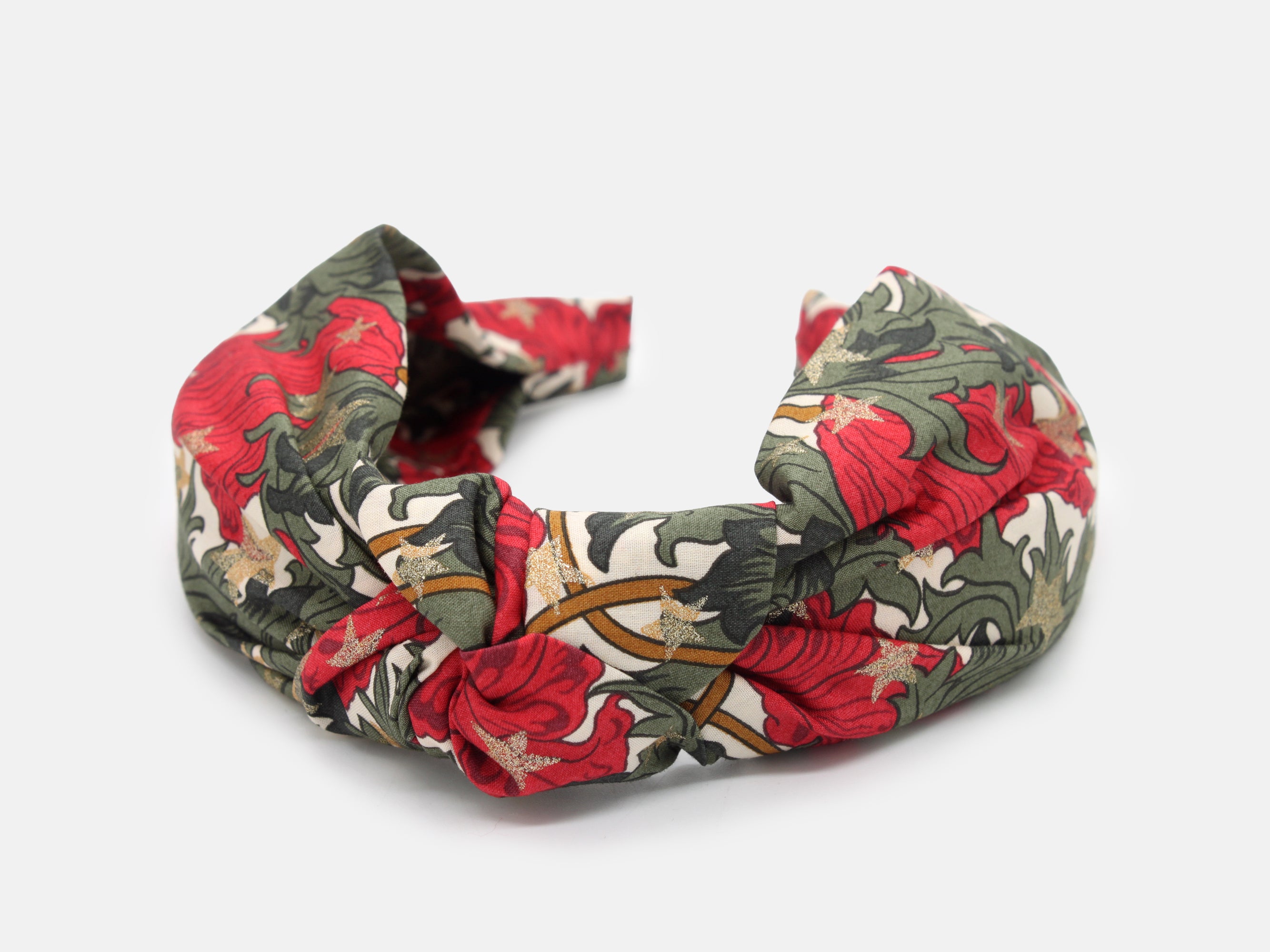 A festive headband in rich red and green, scattered with shimmering gold stars | Classic Knot Headband - Liberty Merry Reverie Print | Holme & Moss