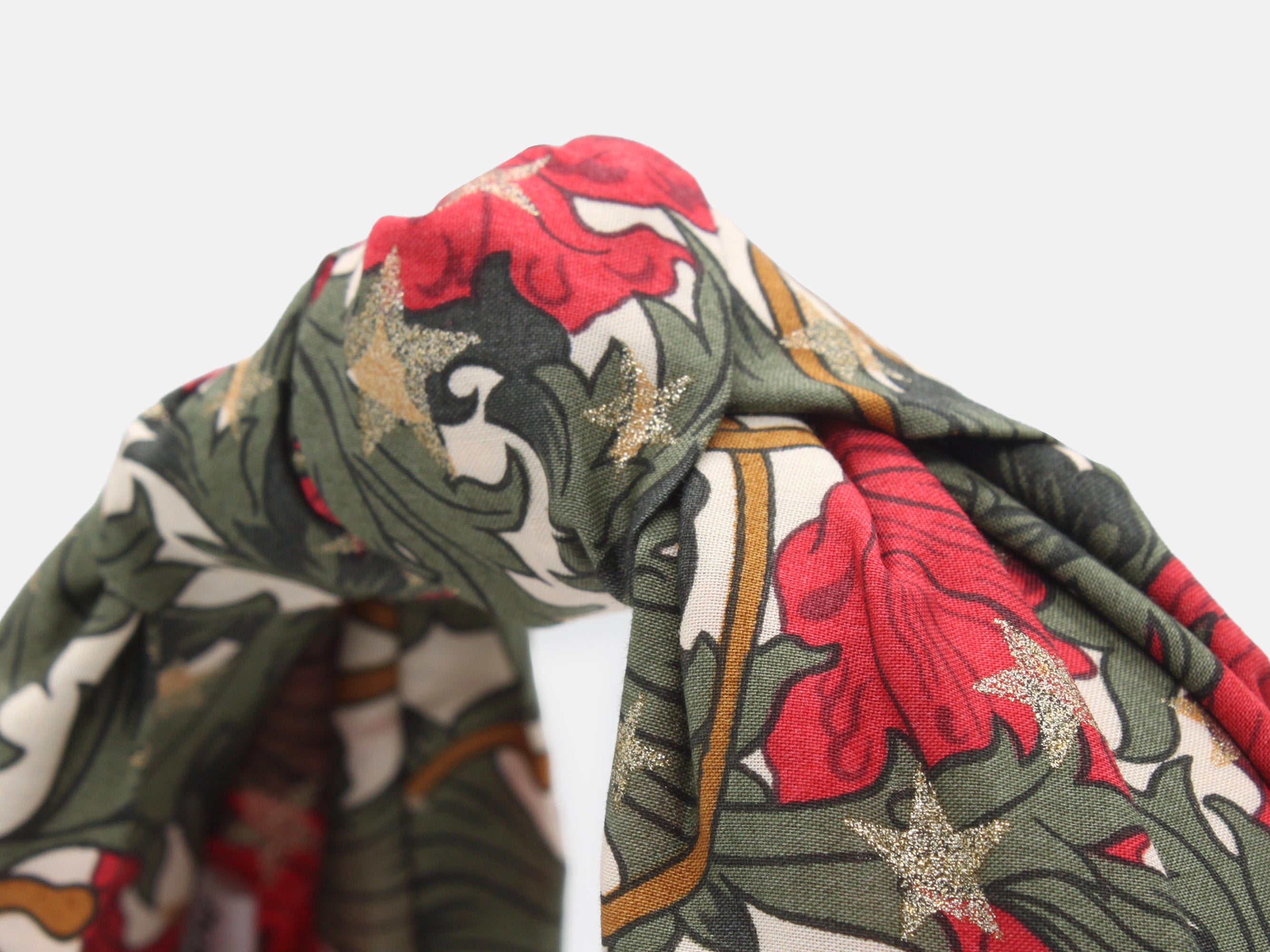 Close-up of a floral patterned fabric with red, green, and white colours | Classic Knot Headband - Liberty Merry Reverie Print | Holme & Moss