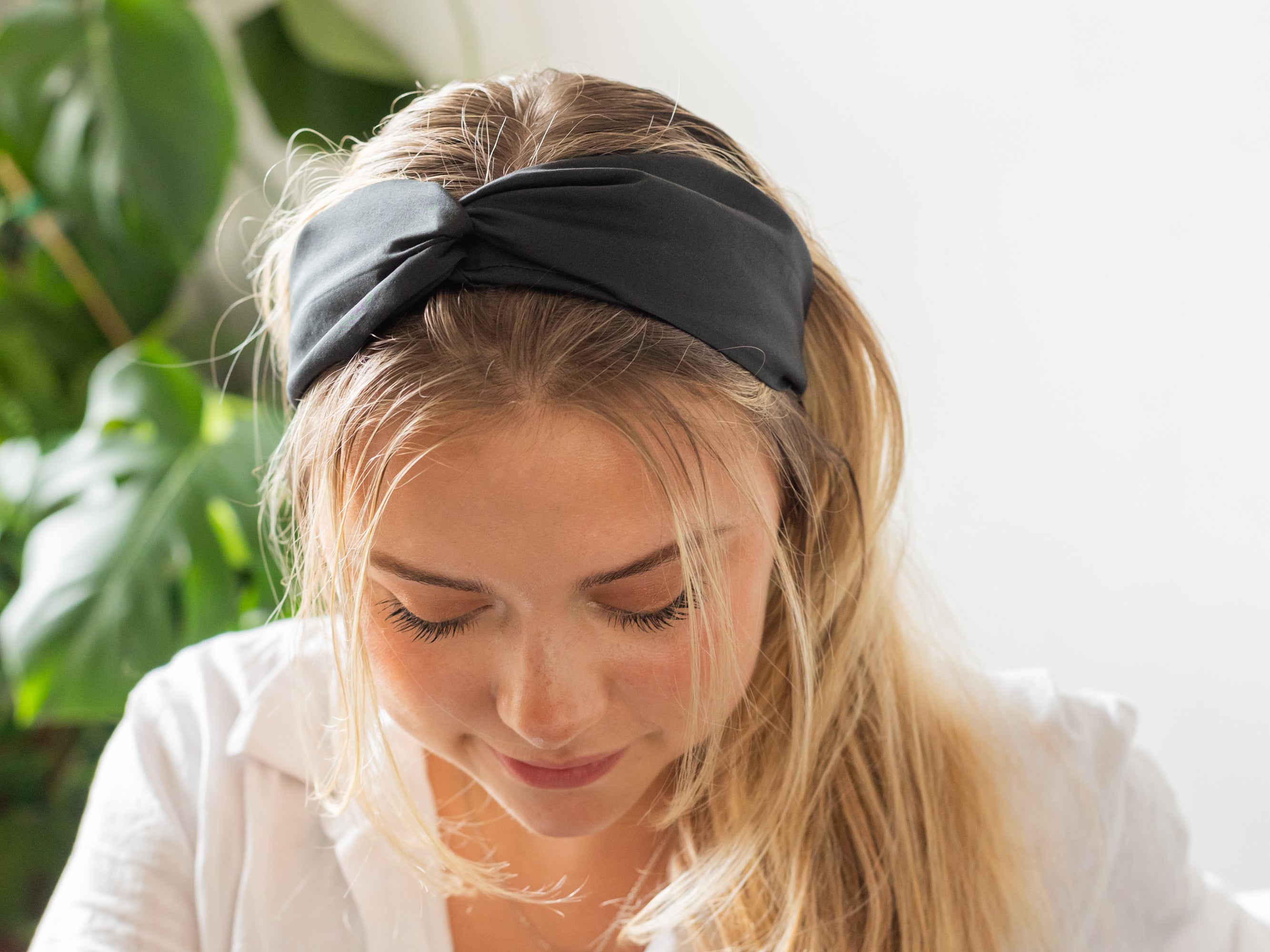 Model wearing twist Headband, Liberty London Black F Print | Holme & Moss