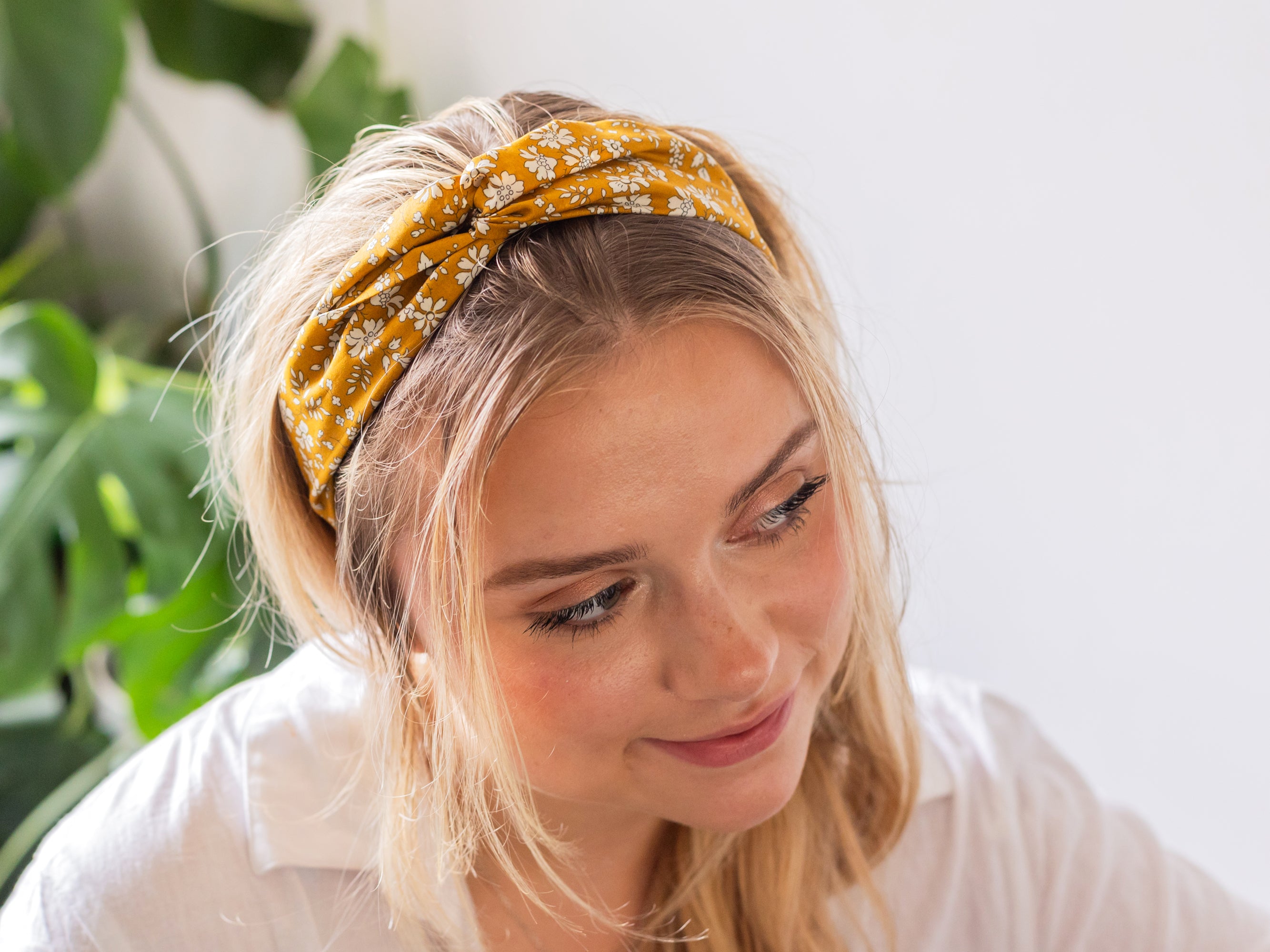 Model wearing twist Headband, Liberty London Capel G Print | Holme & Moss