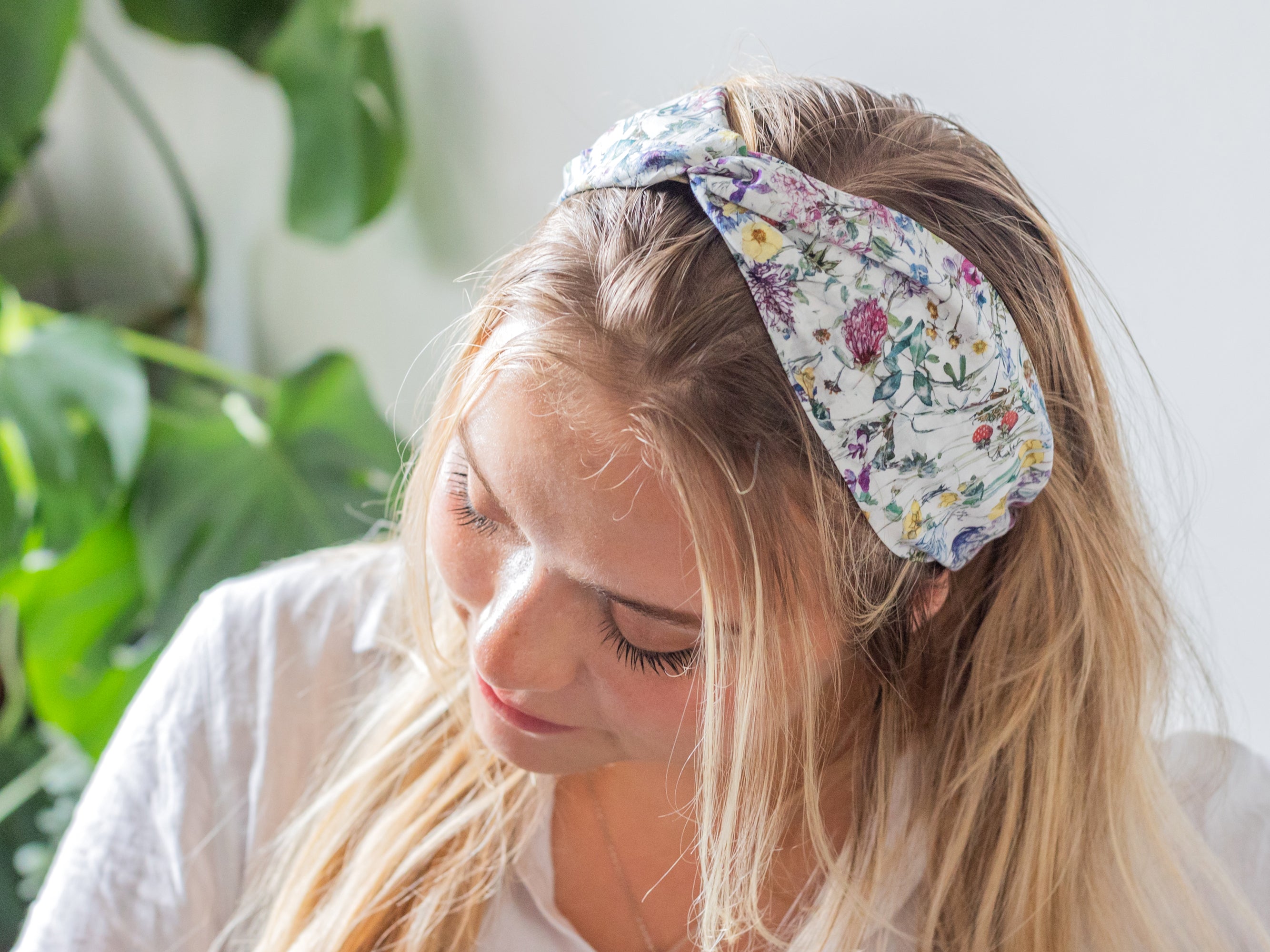 Model wearing twist Headband, Liberty London Wild Flowers Print | Holme & Moss