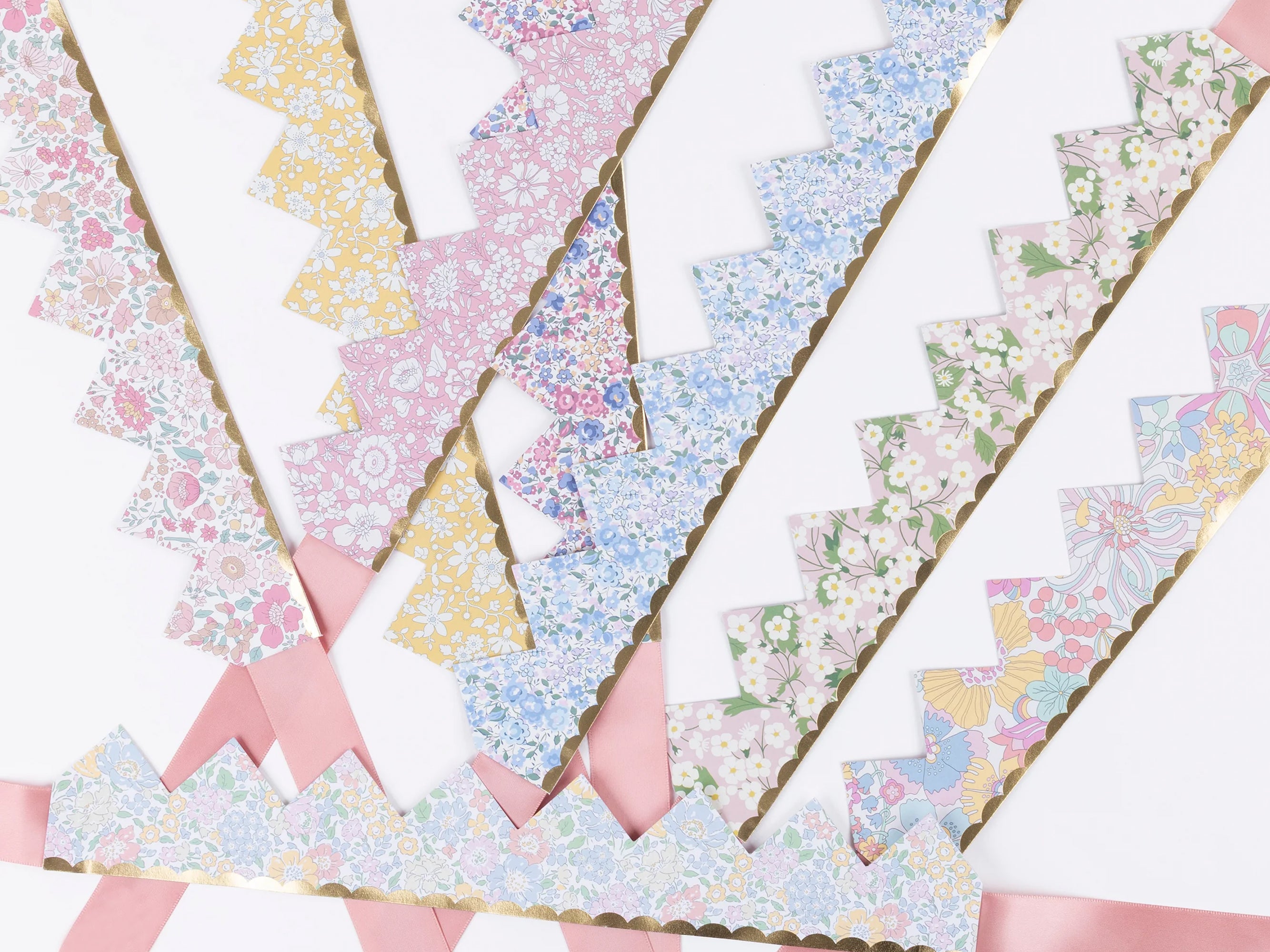 Set of colourful Liberty paper crowns with floral patterns on a white background | Meri Meri x Liberty Party Crowns (8) | Holme & Moss