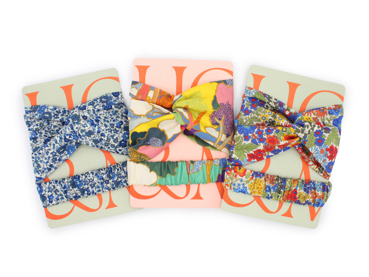 A group shot with twist headband branded Holme & Moss packaging