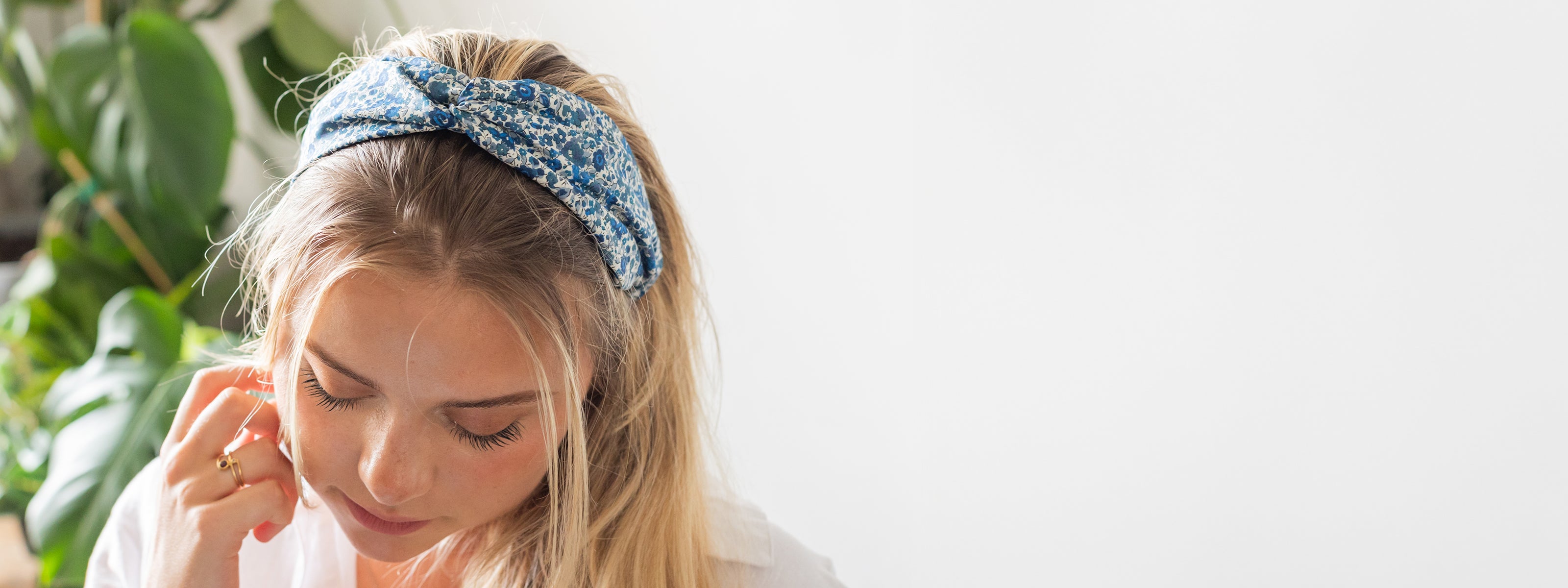 Model wearing Liberty London print twist headband | Holme & Moss