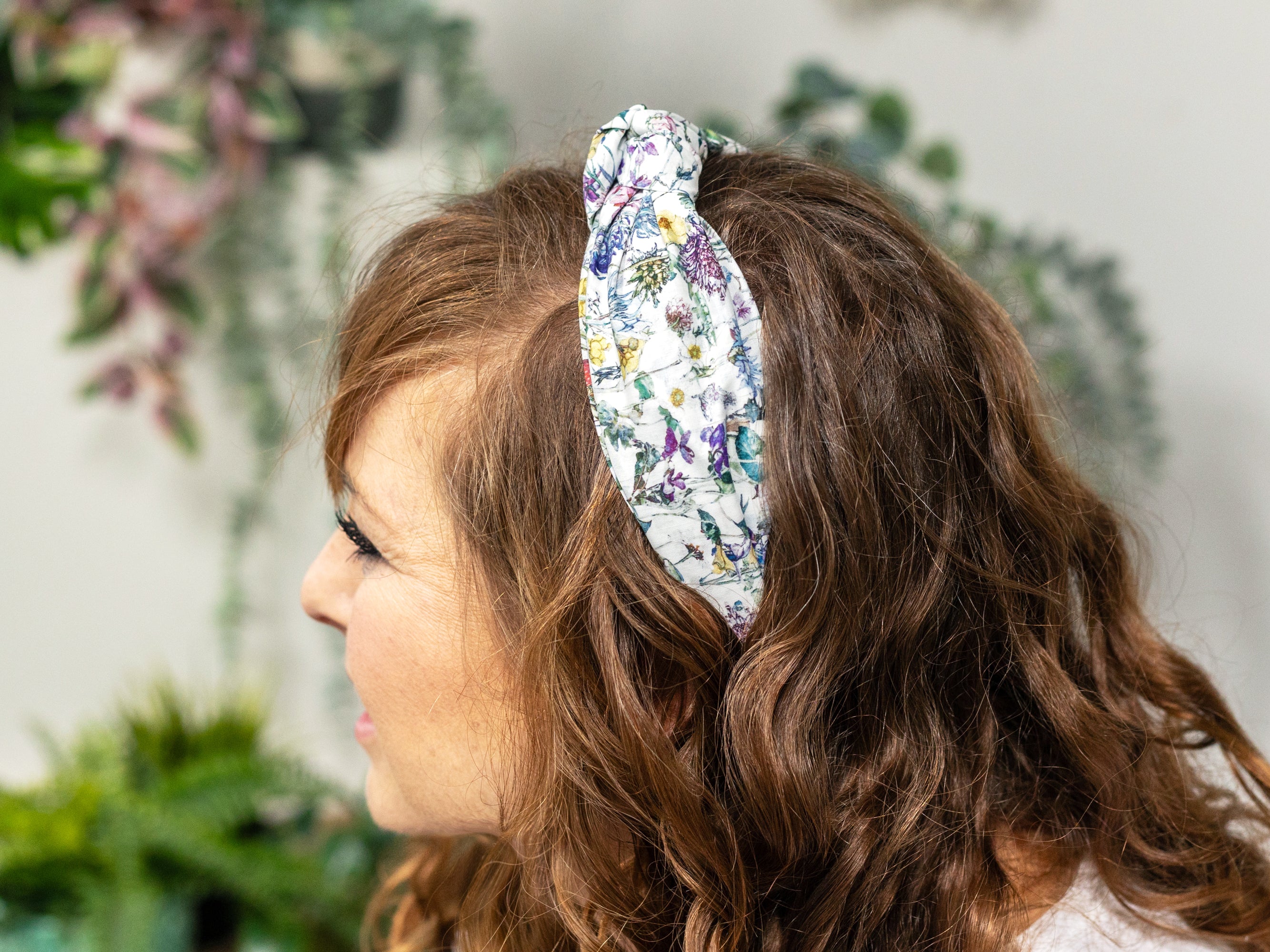 A Model Wearing A Classic Knot Headband, Liberty London Wild Flowers Print | Holme & Moss