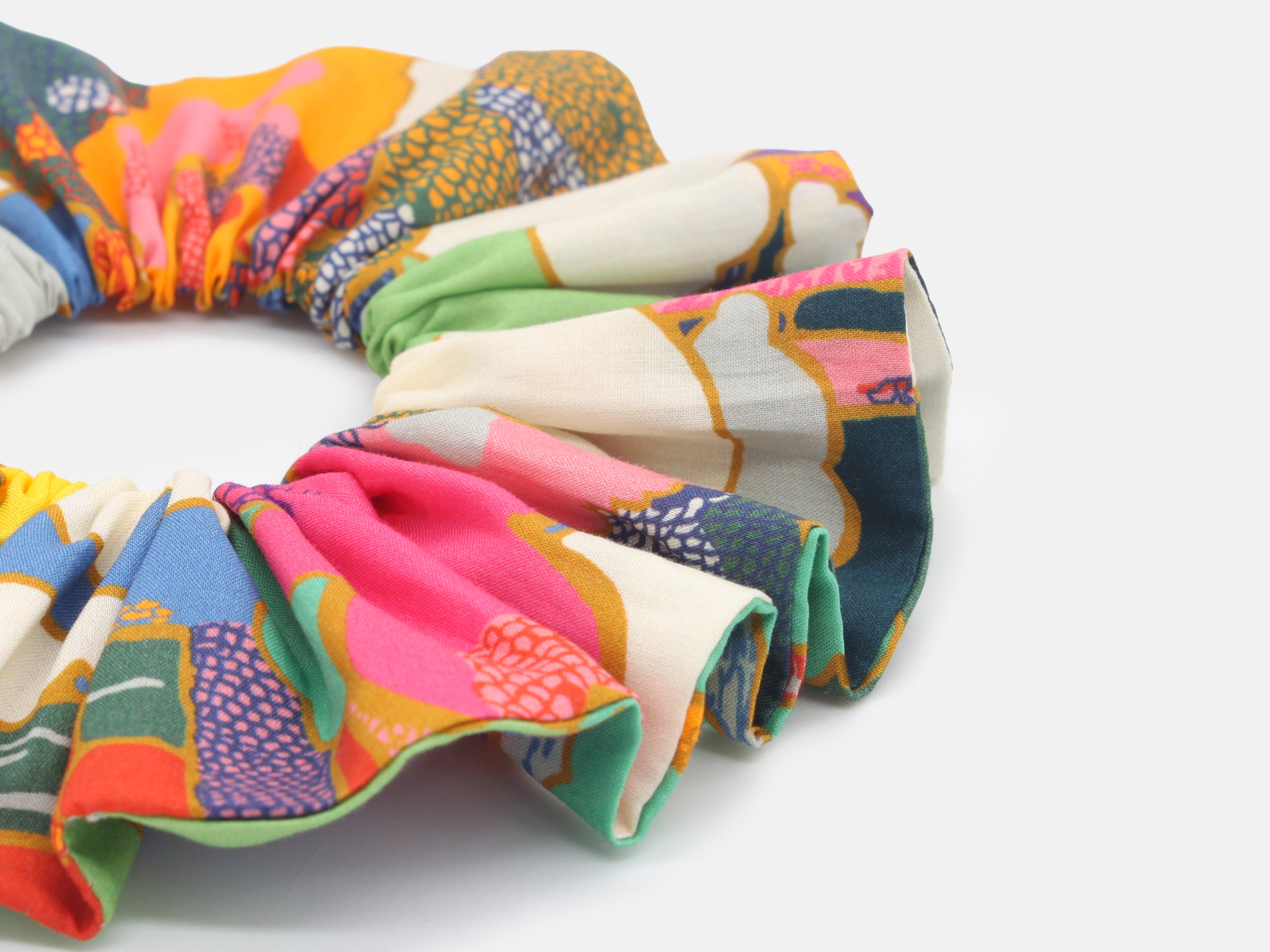 Close up of multi-coloured fabric scrunchie on a white background | Large Scrunchie - Liberty Fabrics Prospect Road A Print | Holme & Moss