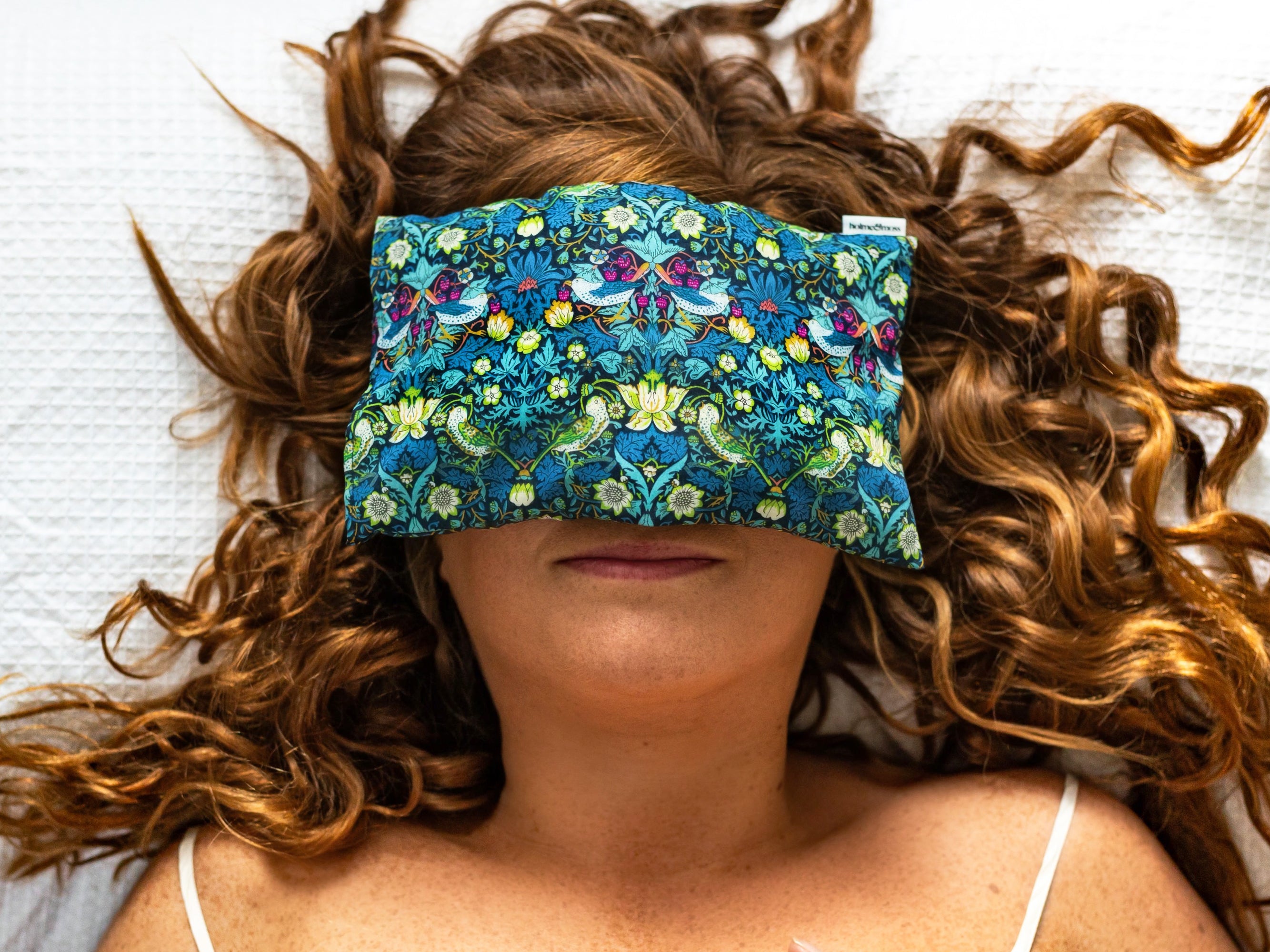Model Wearing Eye Pillow Fragranced with Lavender and Chamomile | Holme & Moss