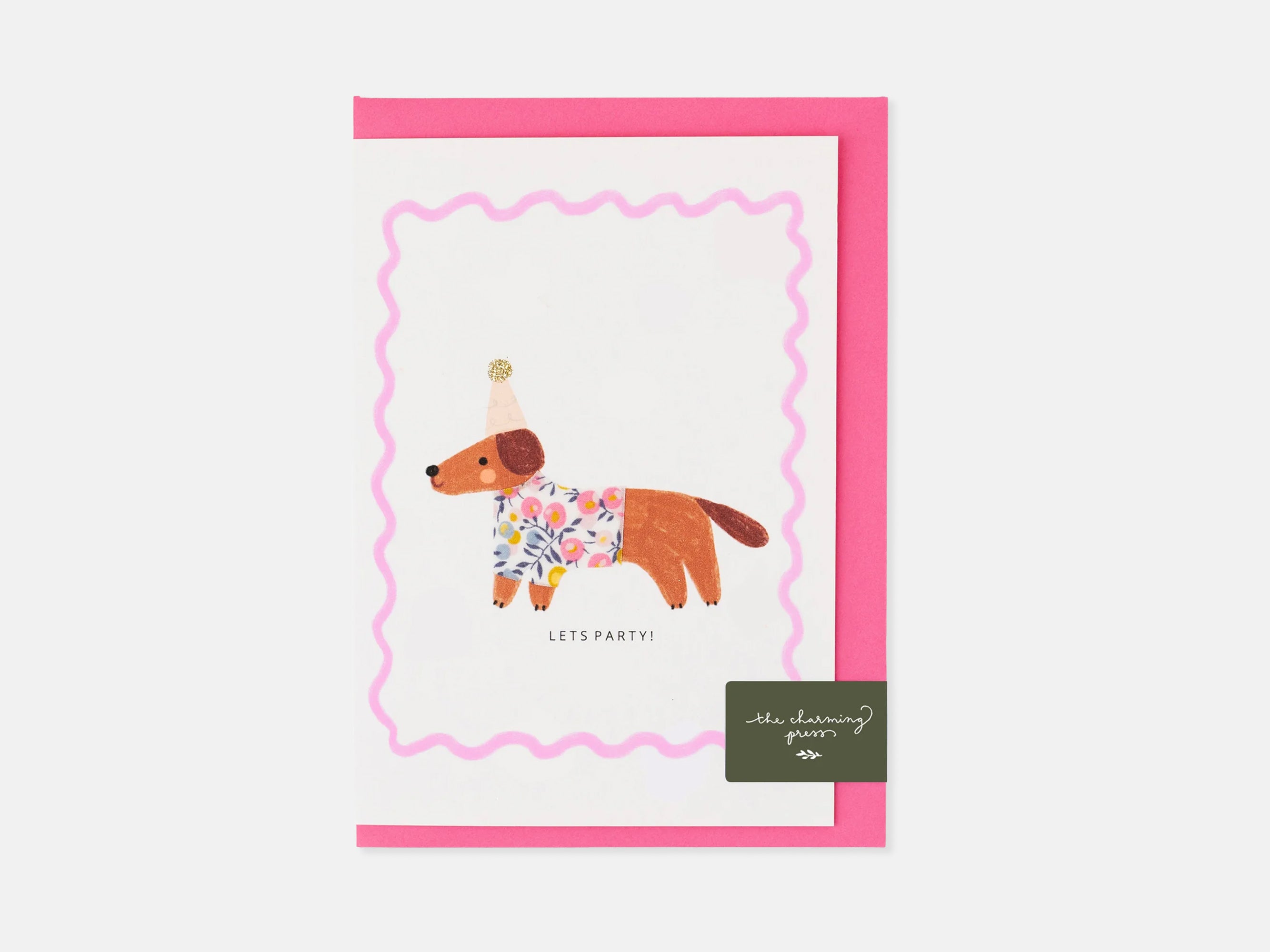 Greeting card with a dog illustration and pink border on a white background | Sausage Dog Birthday Card - Liberty Wiltshire Bud Print | Holme & Moss